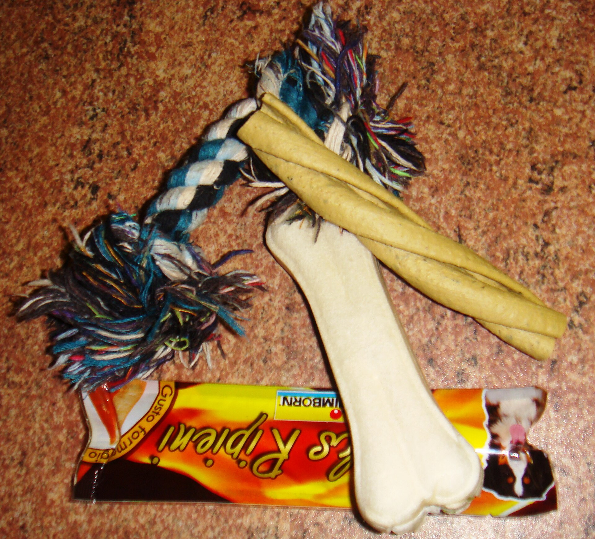 A packaged dental chew shaped like a bone.