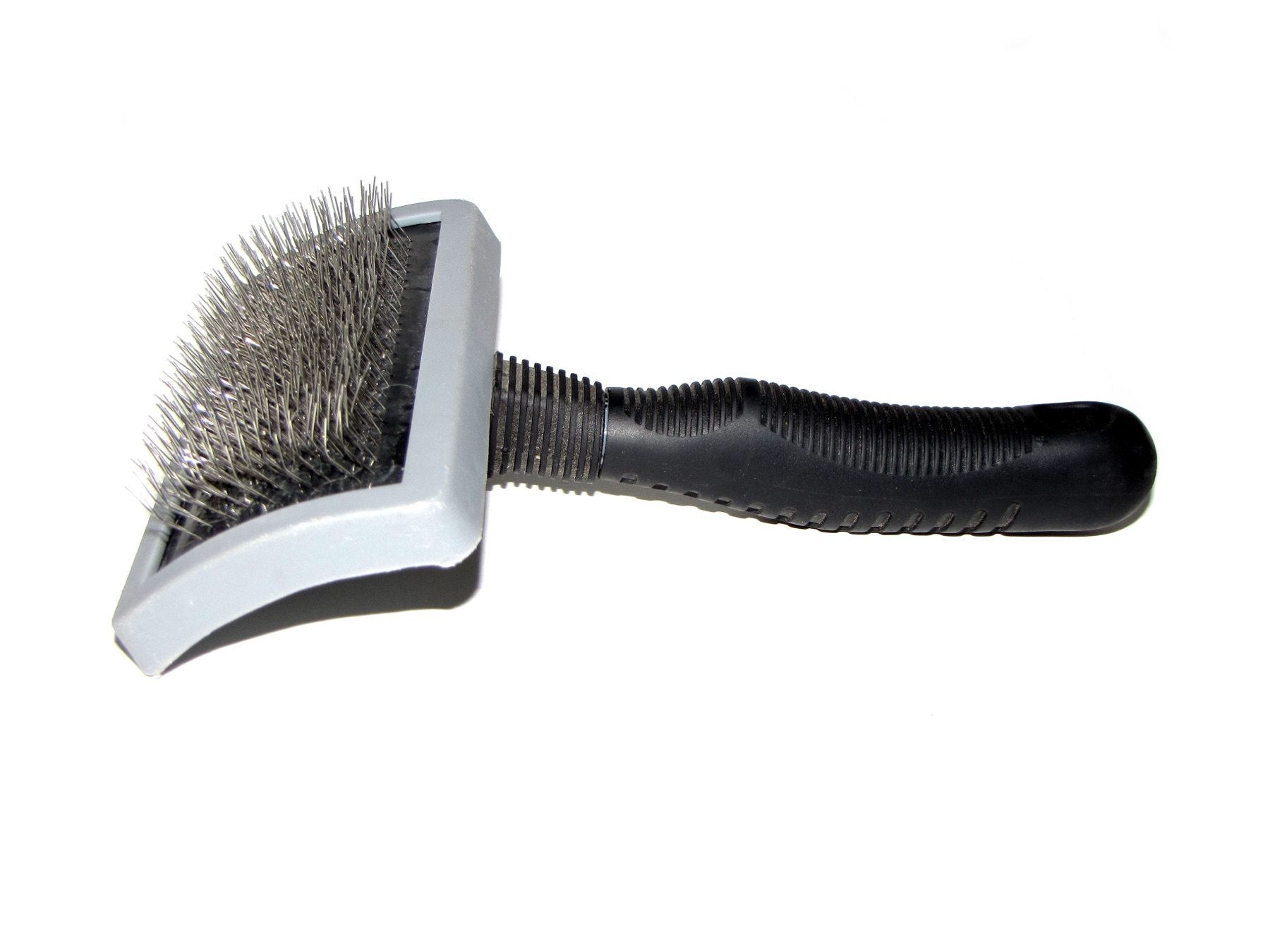 A rubber dog brush designed to lift loose hair